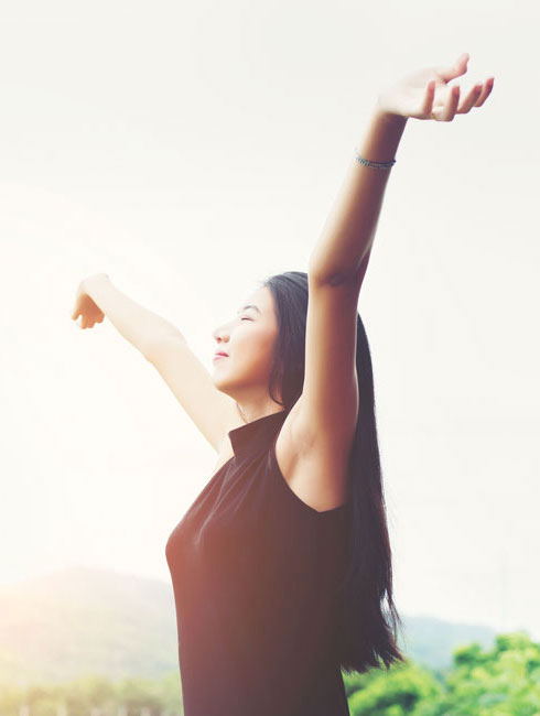 Image: Woman enjoying the sunshine